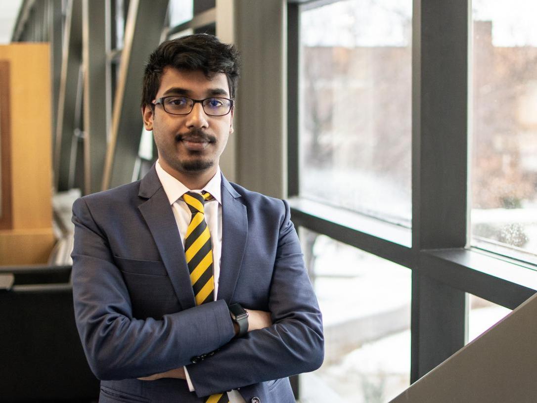 Male business student posing indoors.